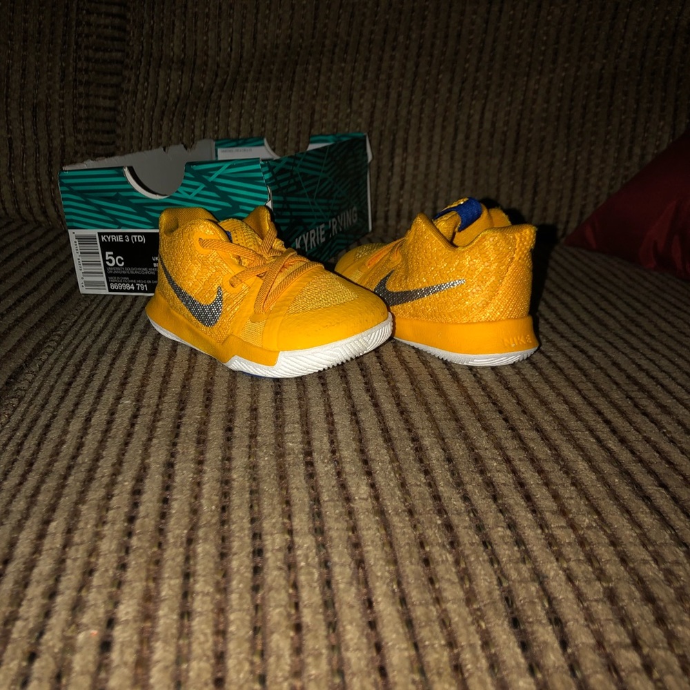 Yellow and silver Nike